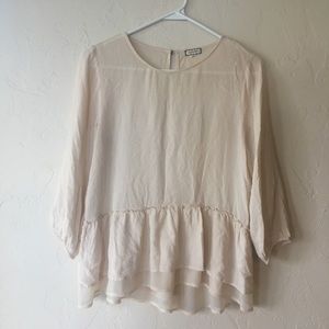 Cream blouse with ruffled bottom